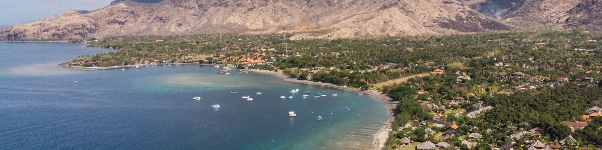 Dramatic aerial view of North Bali coastline in Pemuteran, a relax resort town on the famous Indonesia island