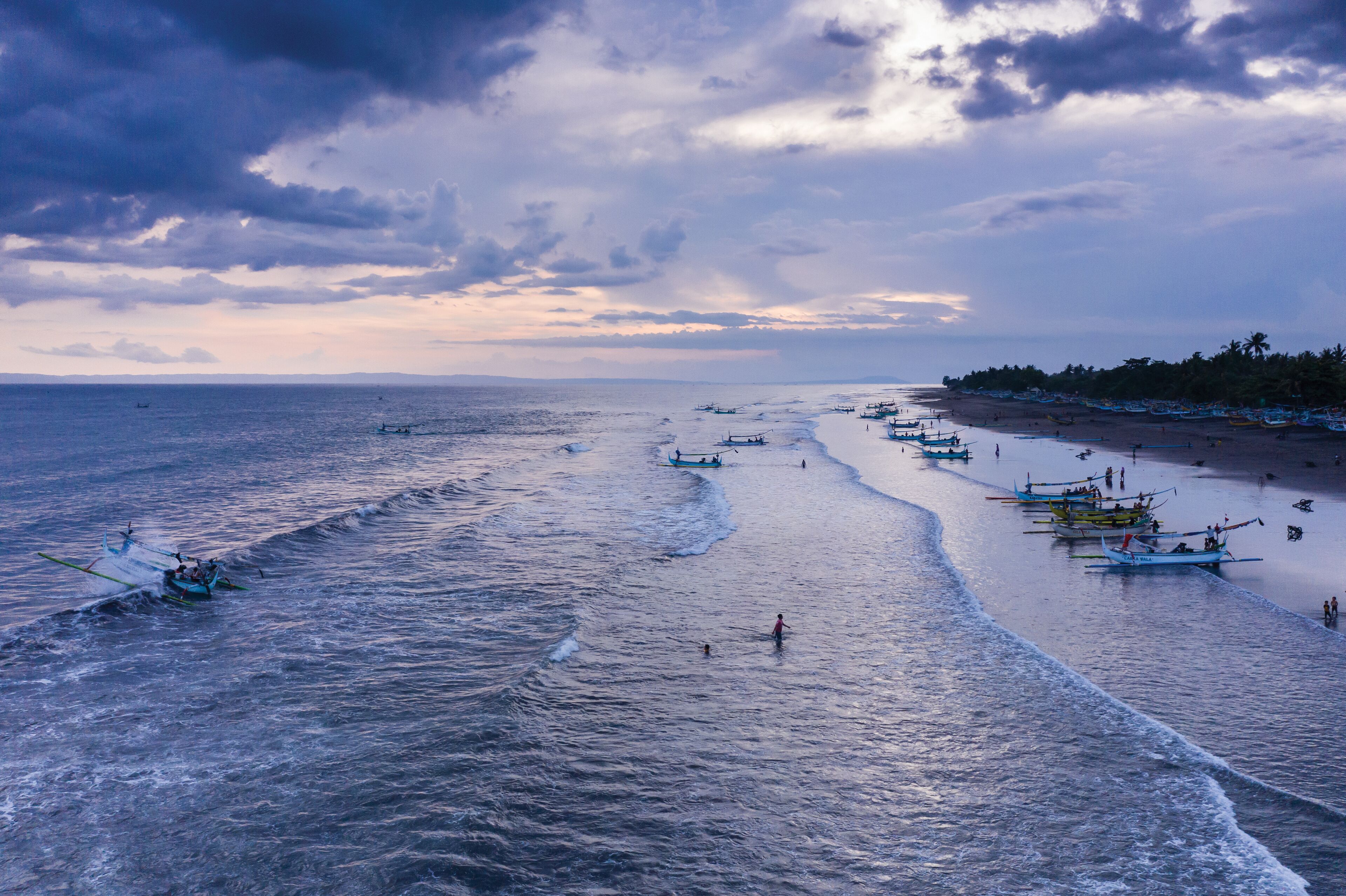 Beach of Perancak with fishing boats in West Bali Indonesia