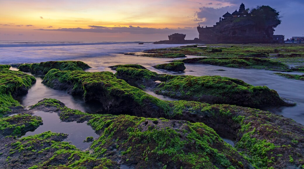 Sunset over Tanah Lot temple in Canggu, Bali, Indonesia.