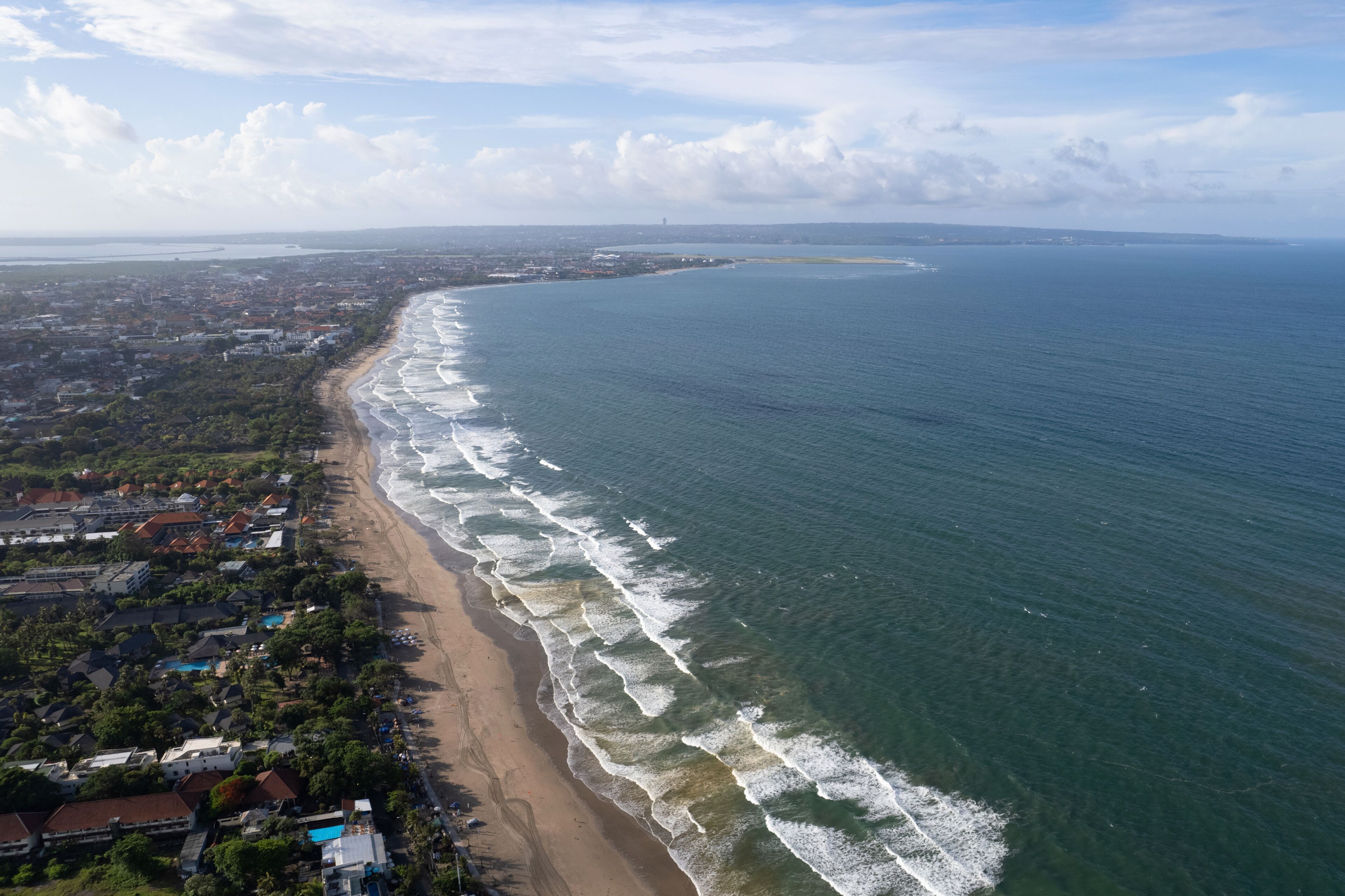 Aerial view of Double Six and Legian Beaches on sunny day. Bali, Indonesia.