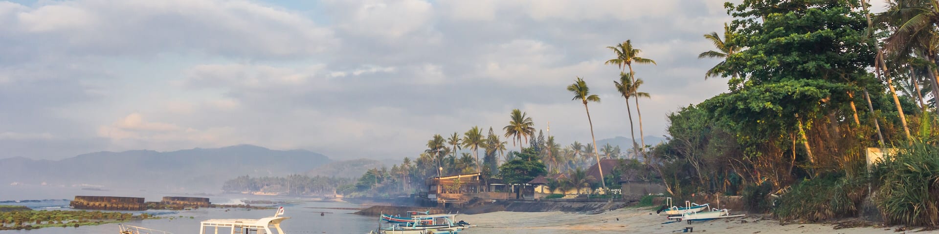 Panorama of small boats at the coast of Candidasa on Bali, Indonesia