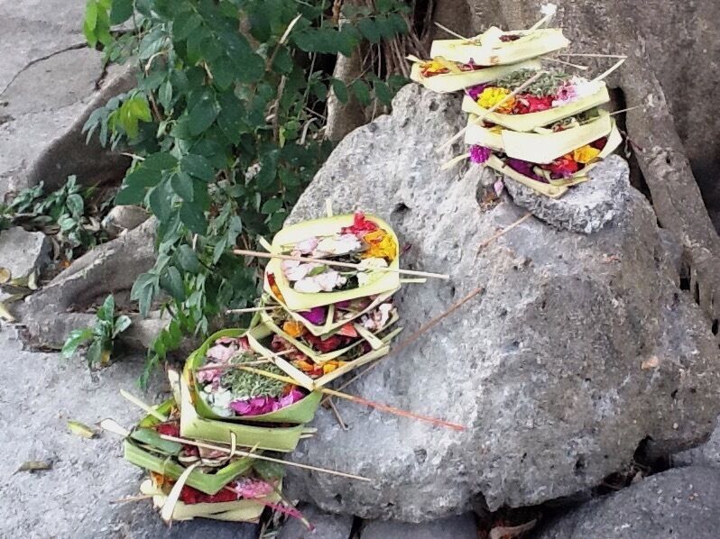 Throughout Bali, Indonesia, you can find these Hindu offerings at both temples and auspicious places.  

In the local market there are several vendors who sell the various parts of these offerings.