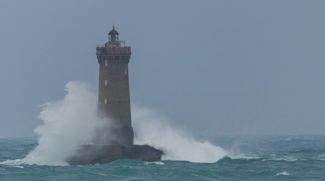 Strong winds made the waves crash beautifully on the lighthouse.