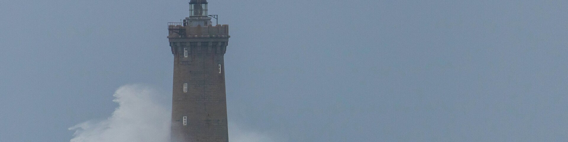 Strong winds made the waves crash beautifully on the lighthouse.