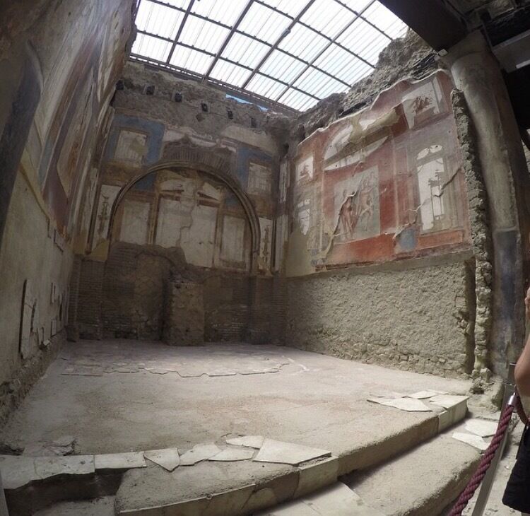 Herculaneum.
I found this place 100x better than pompeii (maybe because i'm lazy and there's less walking) but because of the amount that is preserved, it really does give you a feel of what it was like here.
This picture was inside of a church ( i think?) and to imagine that this survived a volcanic eruption!? 
Overall it was a great day out, very educational ( I recommend a tour guide or a headset). 
Great location, surrounded by places to eat etc. and the train station is roughly 5-10 min walk down a straight road as you leave the station! 
📸: Go Pro ( Hero 4)
