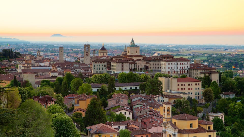 Bergamo showing landscape views, a sunset and a city