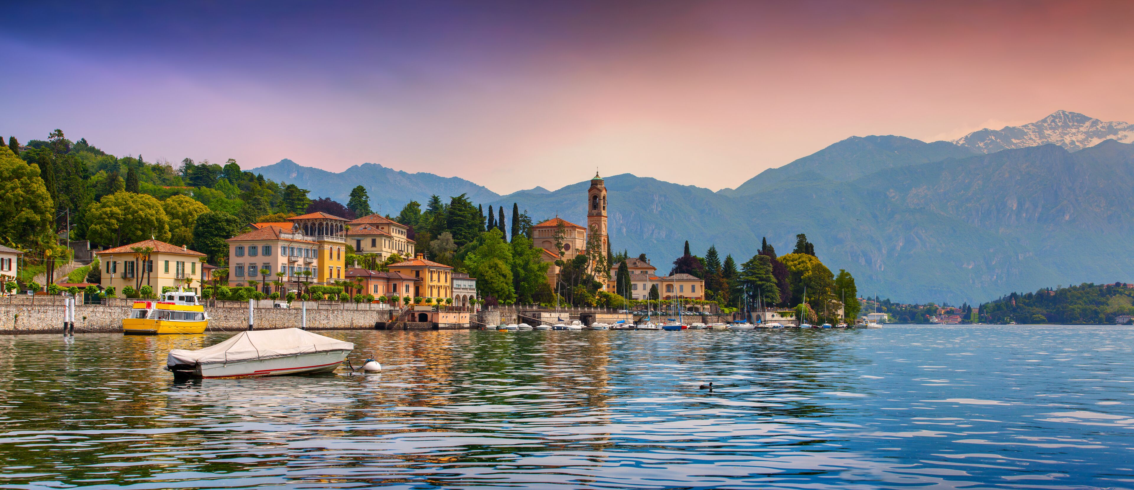 View of the city Mezzegra, Via Statale, Tremezzo CO, Alps, Italy. Colorful evening on the Como lake, Geolocation 45.982351,9.219718; Shutterstock ID 196534562