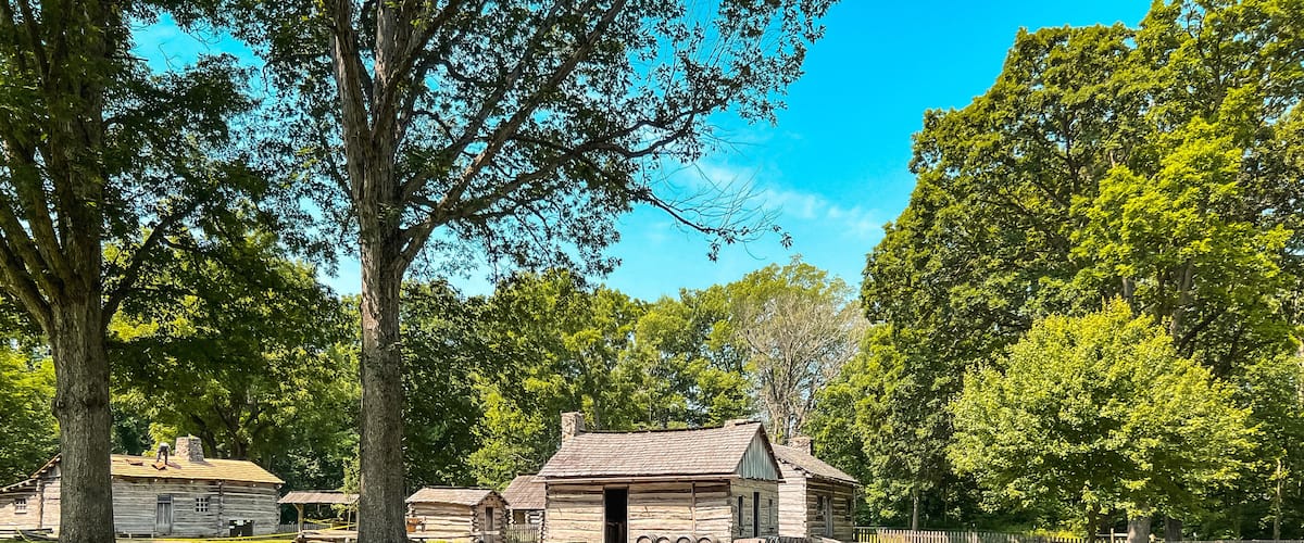 Split Rail Fence and Log Cabin Style Homes at Lincoln's New Salem State Historic Site. A reconstruction of the former village where Abraham Lincoln lived 1831 to 1837. Public park on public land.