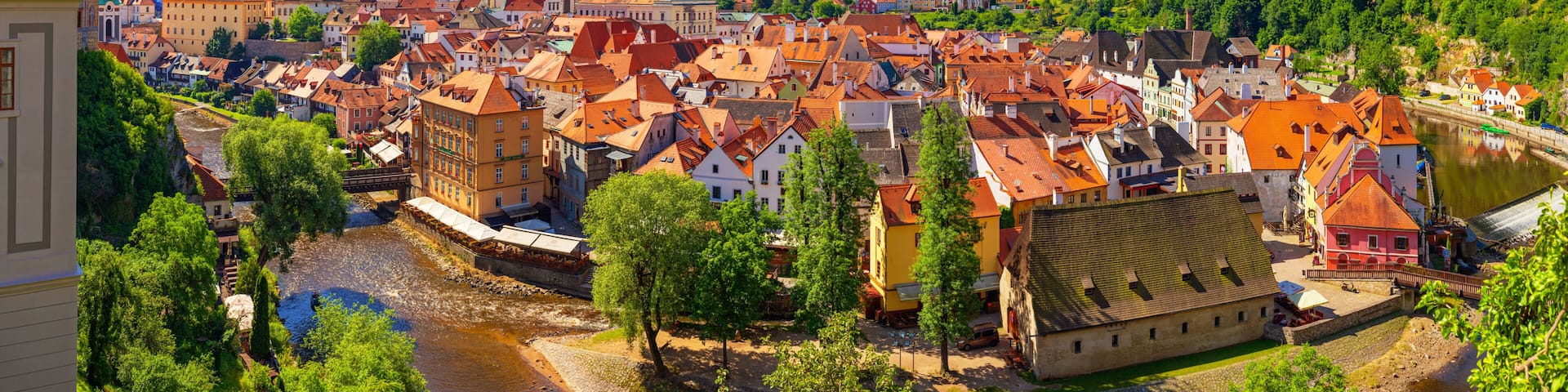Summer cityscape, panorama, banner - top view of the Old Town of Cesky Krumlov and the Vltava river, Czech Republic