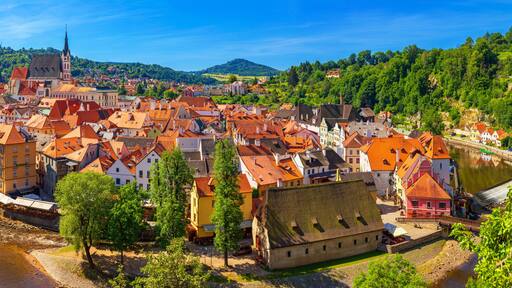 Summer cityscape, panorama, banner - top view of the Old Town of Cesky Krumlov and the Vltava river, Czech Republic