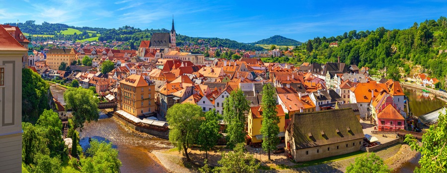 Summer cityscape, panorama, banner - top view of the Old Town of Cesky Krumlov and the Vltava river, Czech Republic