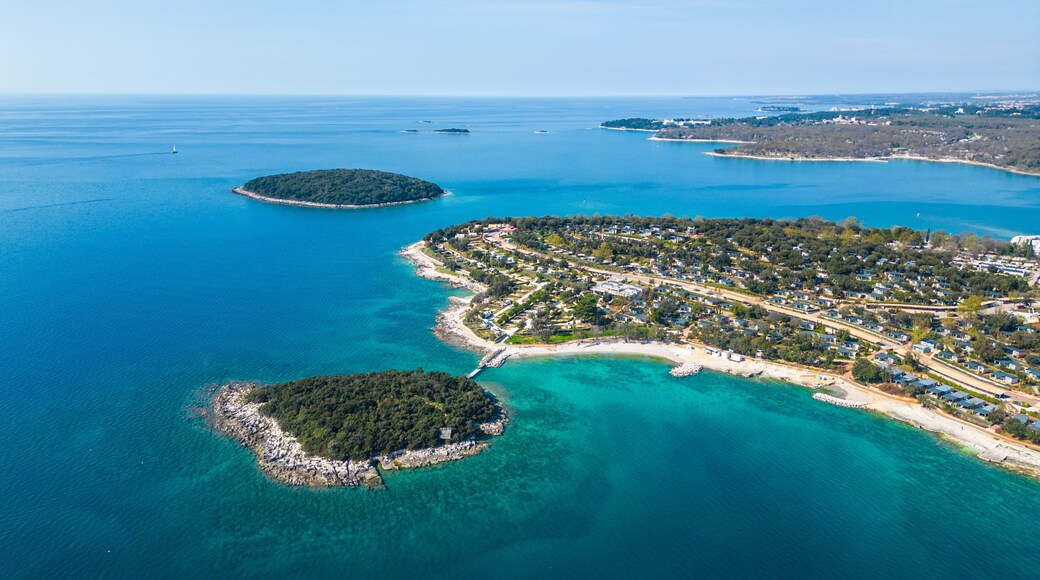 Aerial photo of Funtana in Istria, Croatia, featuring Valamar Camping Istra. This picturesque coastal area offers crystal-clear Adriatic waters, lush Mediterranean greenery, and top-class camping