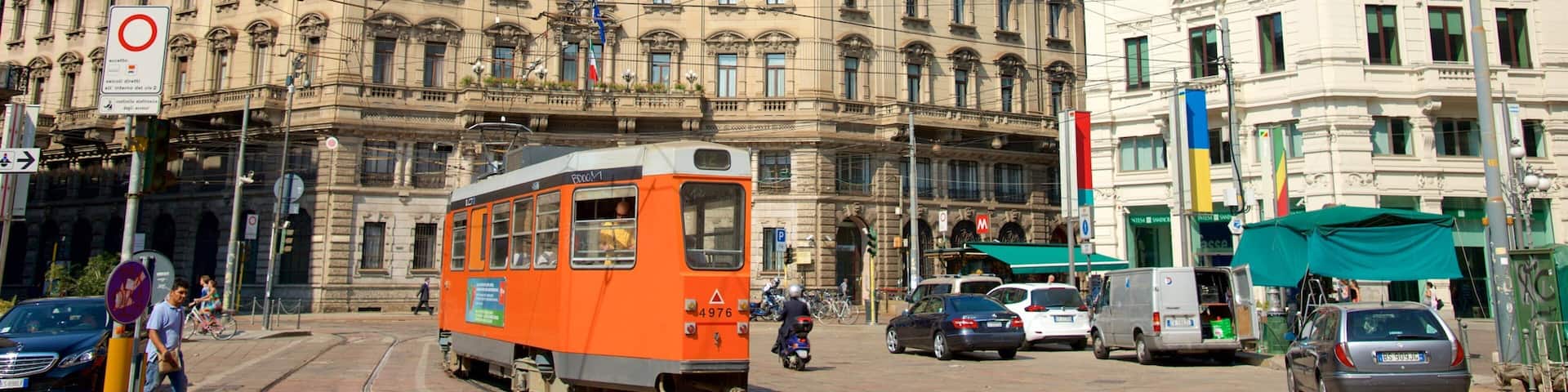 Milan which includes street scenes, railway items and a square or plaza