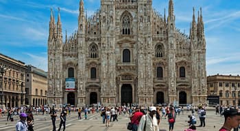 The Duomo of Milan seen from the Piazza, with tourists around on a typical summer day