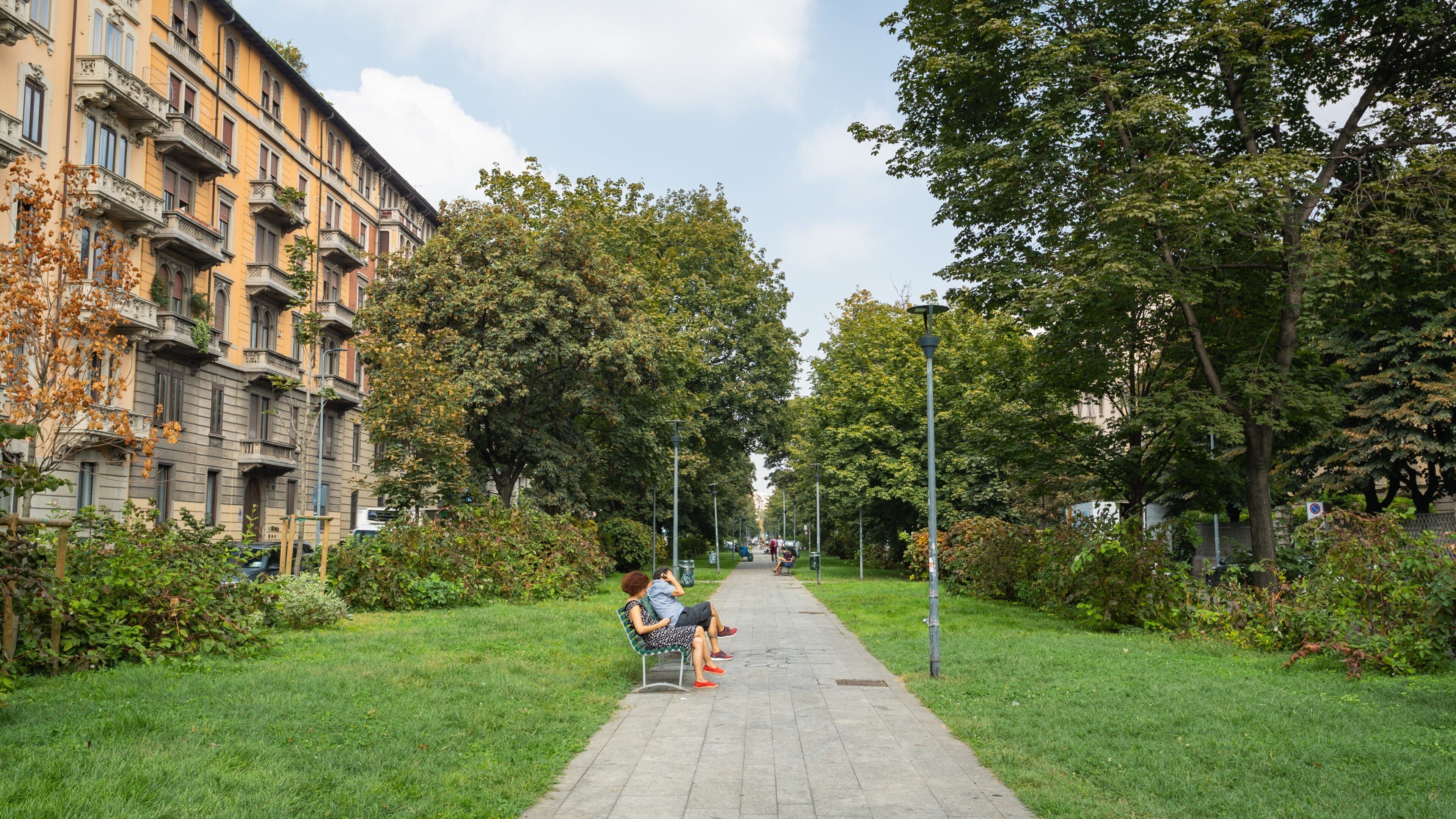 Porta Vittoria showing a park as well as a couple