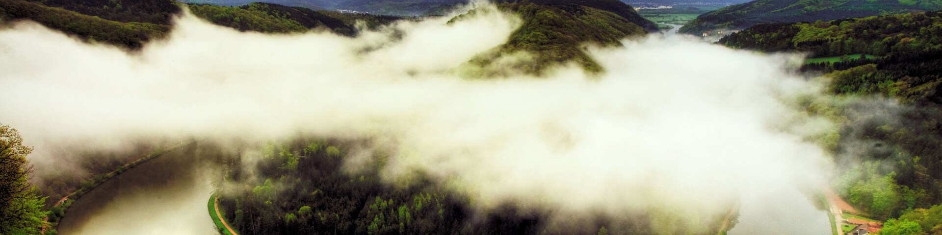 Please take a large view! The Saar is a river in northeastern France and western Germany, and a right tributary of the Moselle River. It rises in the Vosges mountains on the border of Alsace and Lorraine, with two headstreams (Sarre Rouge and Sarre Blanche, united in Lorquin), that both start near Mont Donon, the highest peak of the northern Vosges. After 246 km (126 km in France and 120 km in Germany) the Saar flows into the Moselle River at Konz (Rhineland-Palatinate), having a catchment area of 7,431 km². In former times, the Saar was very important for the Saarland industries of coal, iron and steel. Raw materials and finished products were shipped on it by water via the Saar Coal Canal, the Marne-Rhine Canal and the Rhine, for instance, to the Ruhrgebiet or the port of Rotterdam. Although the German part of the Saar has been upgraded to a waterway by deepening, construction of sluices and straightening, there is no significant shipping traffic. From Wikipedia, the free encyclopedia