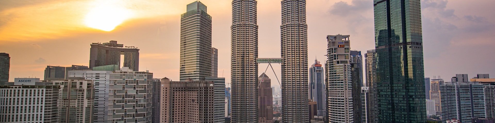 Golden Triangle showing a sunset, a city and a skyscraper