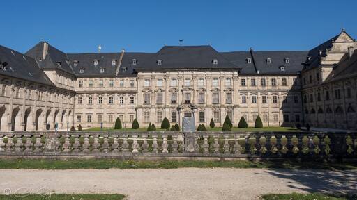 The former Cistercian Kloster Ebrach, built in Gothic style, was founded in 1127. In 1200, Abbot Hermann I set to work on building the church, which was finished in 1280. More than 50 windows, 26 altars and, above the portal, a rose window adorn the building. The abbey was dissolved in 1803 in the course of Secularization. Since 1851, the abbey buildings served as a prison, nowadays known as Justizvollzugsanstalt Ebrach.