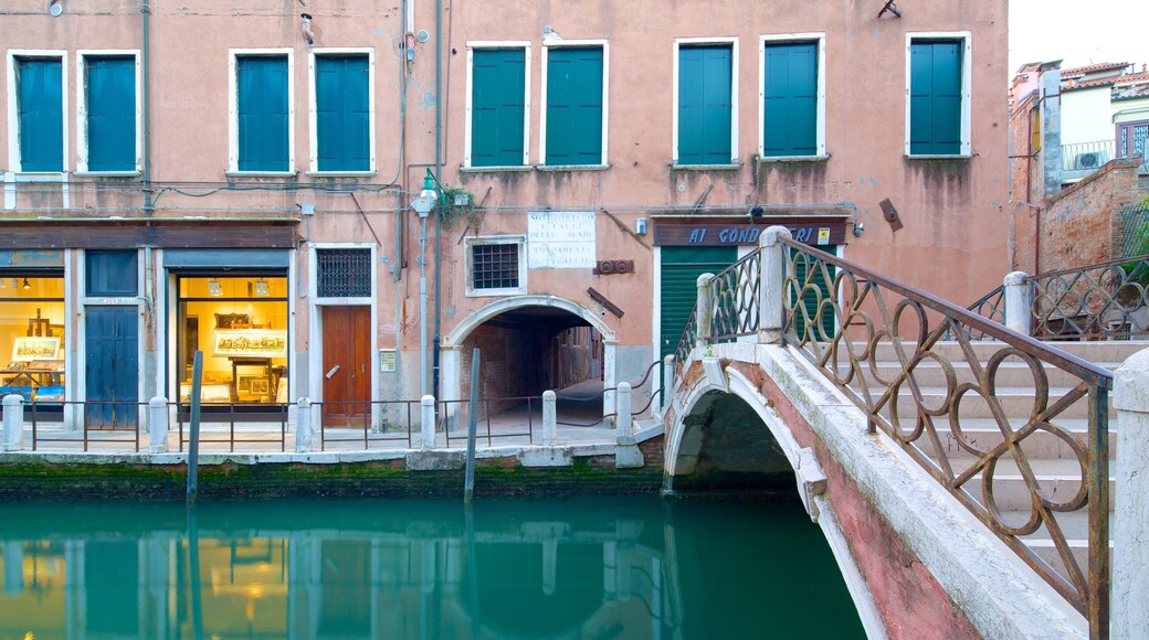 Dorsoduro which includes a river or creek and a bridge