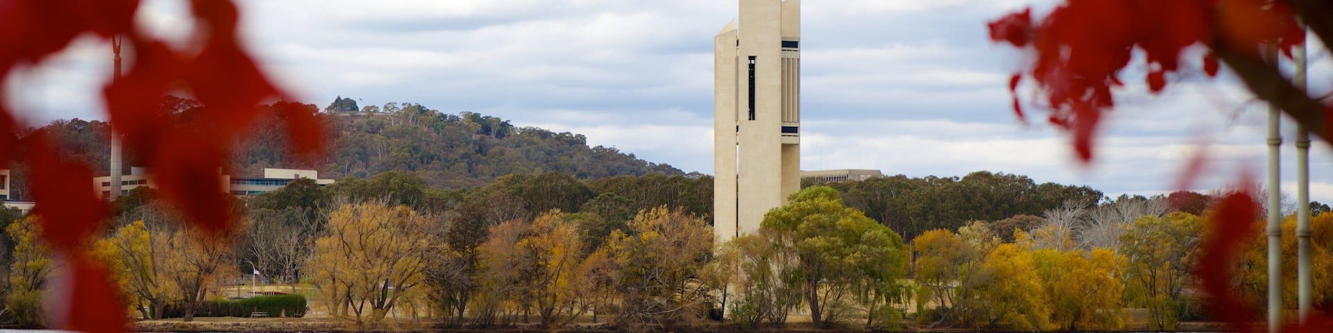 Canberra showing a lake or waterhole and a monument