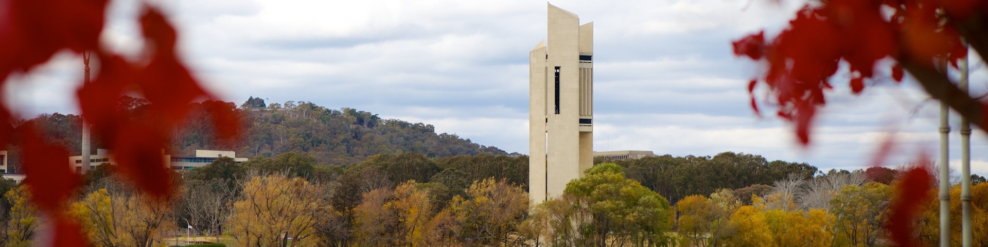 Canberra showing a lake or waterhole and a monument