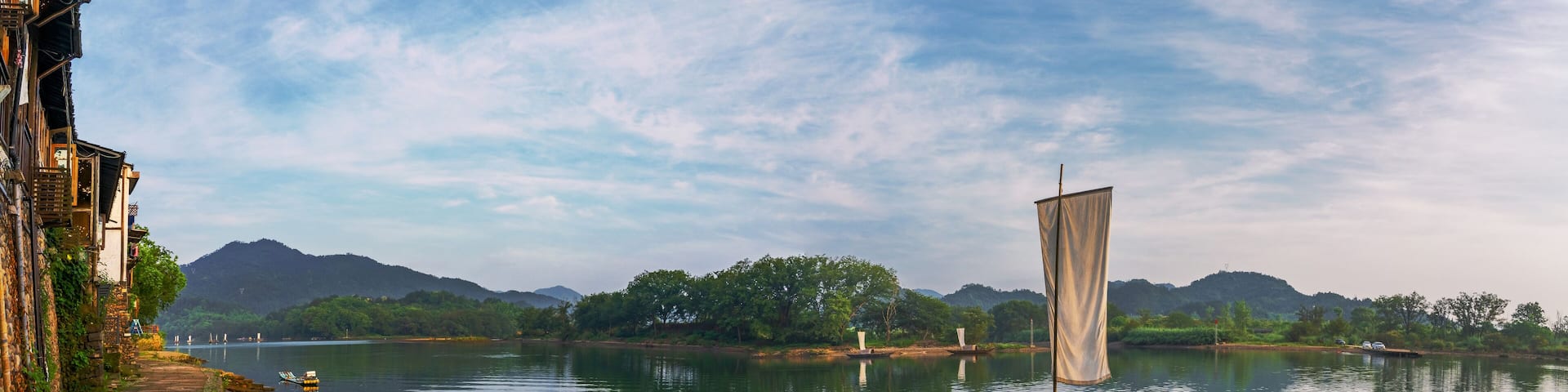 Mountains, Oujiang River, fishing boats, and ancient towns in Lishui City, Zhejiang Province, China On May 24th, 2024