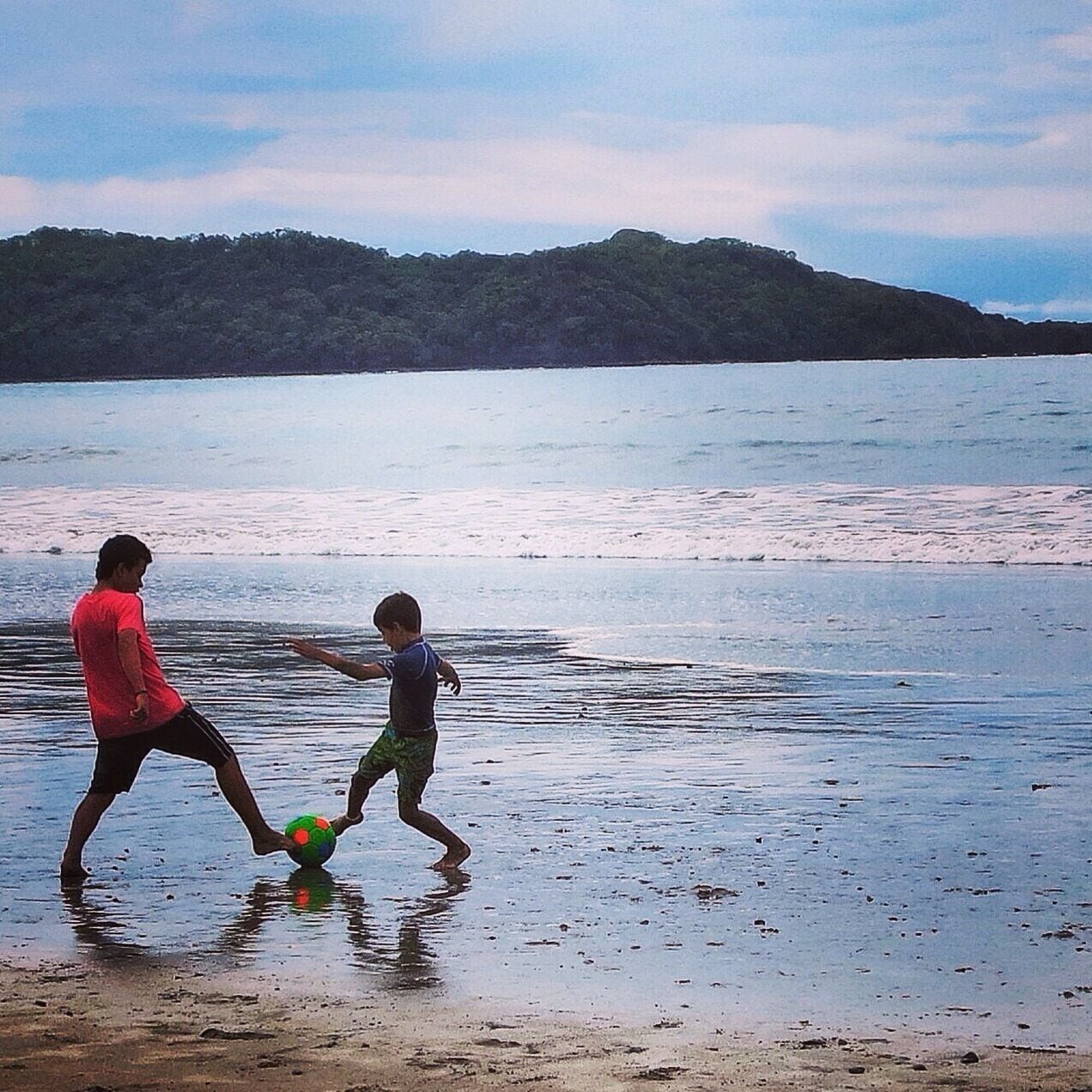 Father and son kick the futbol around on Playa Brasilito. Pura vida. #beach