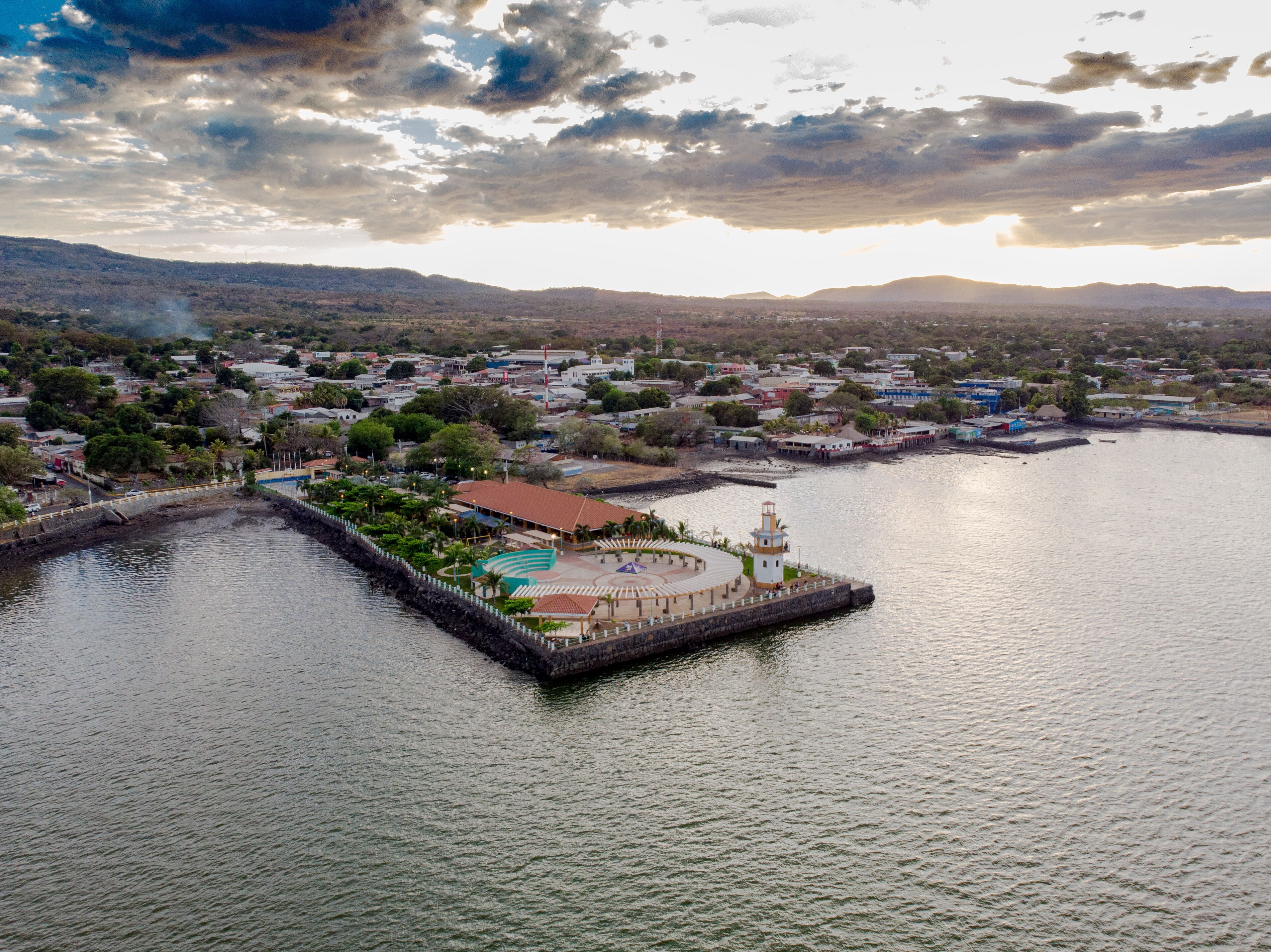 Aerial view of the family park in La Union, El Salvador, where you can see its green areas and much of the city on a cloudy day, both sides of the park is surrounded by water