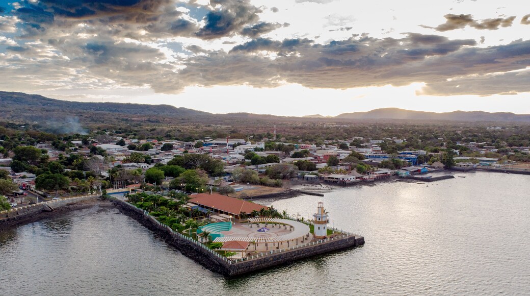 Aerial view of the family park in La Union, El Salvador, where you can see its green areas and much of the city on a cloudy day, both sides of the park is surrounded by water