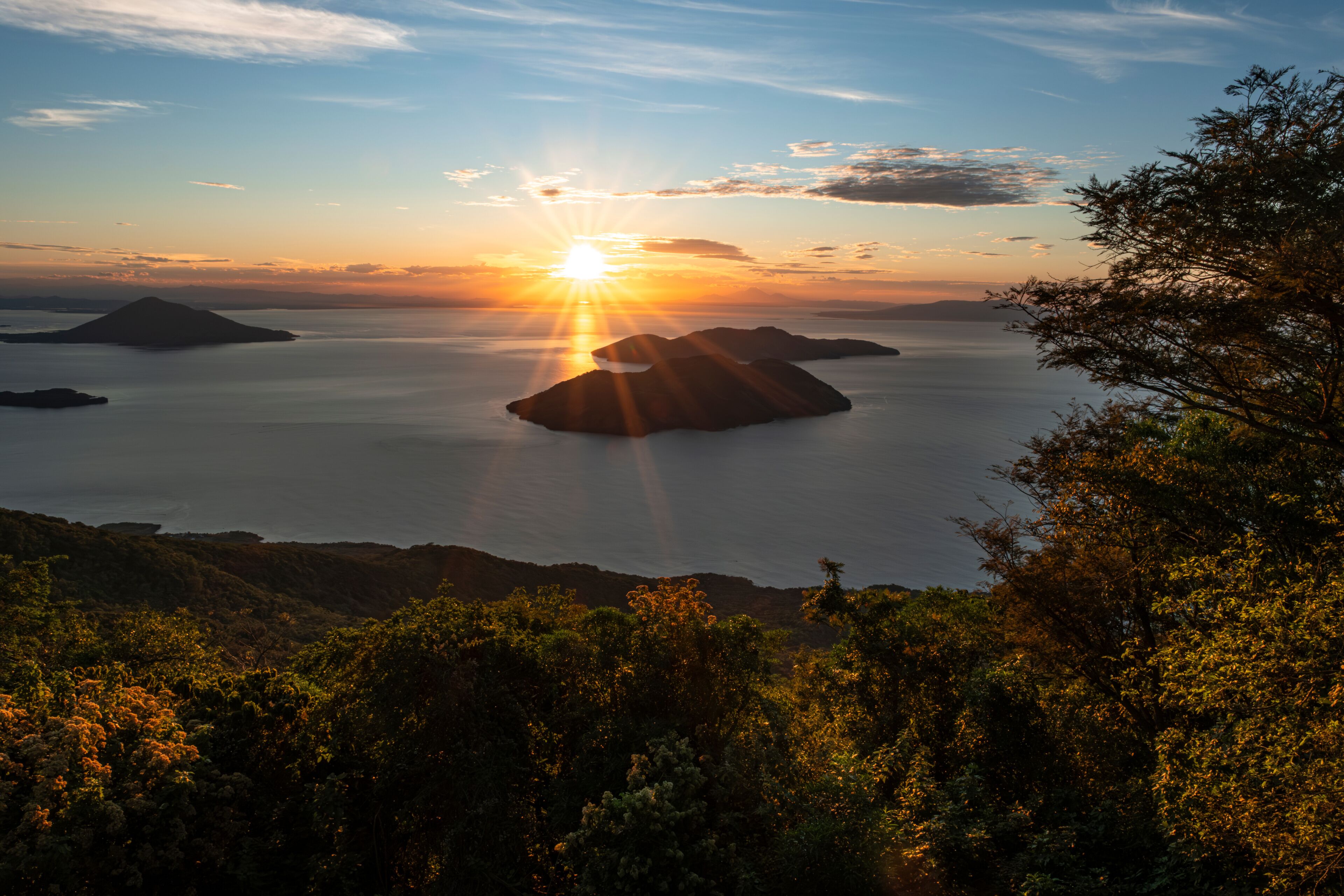 View of Fonesca Gulf and La Union Bay from the top of Conchagua Volcano observation platform at sunrise hour in El Salvador. The place were borders of Honduras, Nicaragua and El Salvador meet.