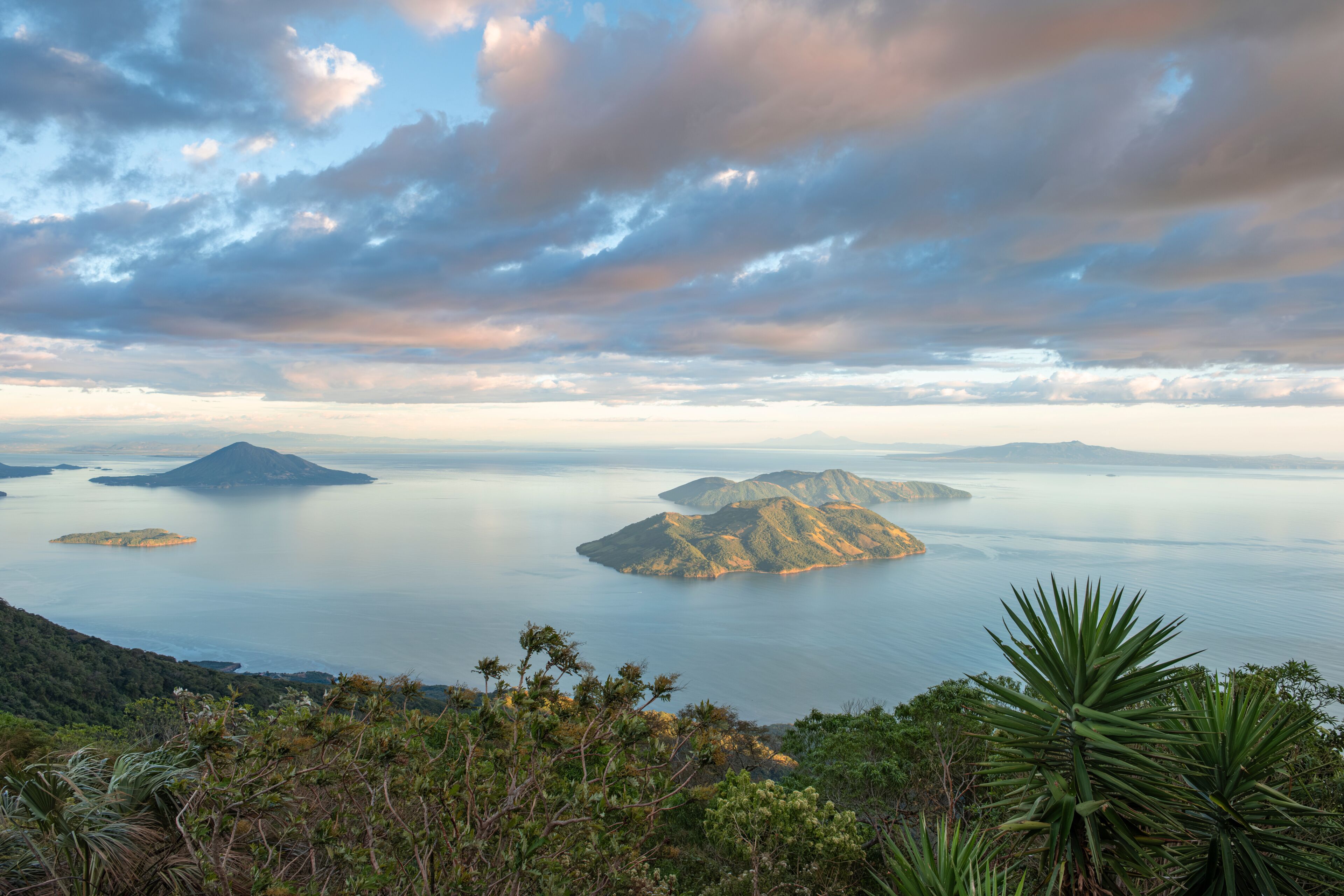 View of Fonesca Gulf and La Union Bay from the top of Conchagua Volcano observation platform at sunset hour in El Salvador. The place were borders of Honduras, Nicaragua and El Salvador meet.