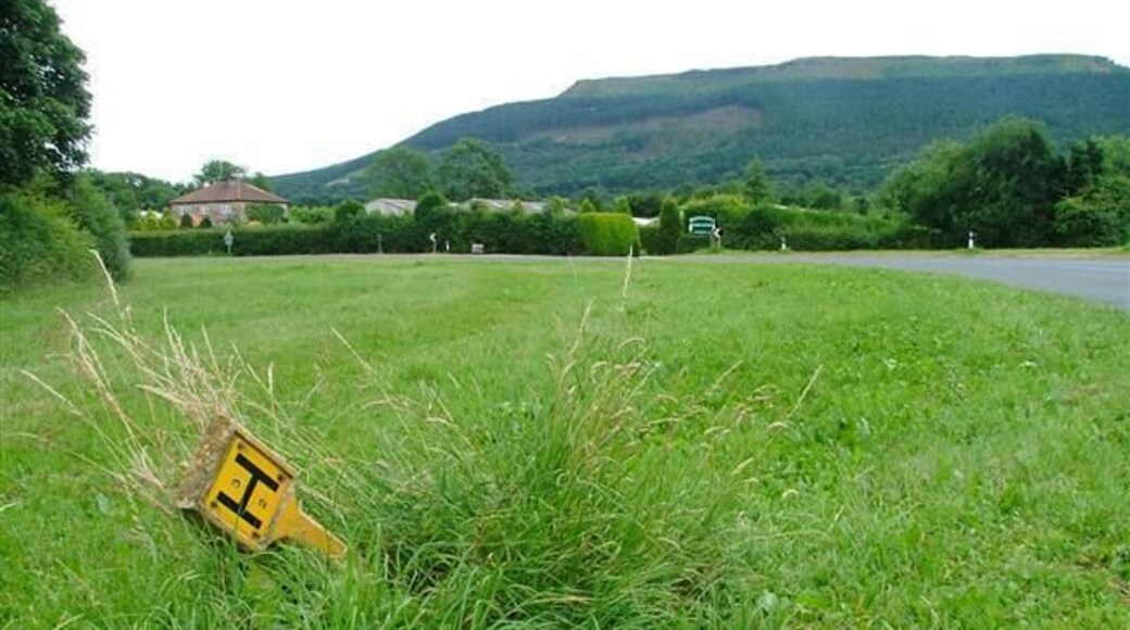 Water Hydrant Sign at Maynards Corner. This sharp bend on the B1257 takes its name from the nurseries seen beyond the road.