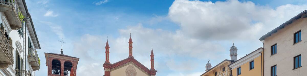 Pinerolo, Turin, Piedmont, Italy - April 29, 2023: San Donato Cathedral (10th - 15th cent.) in San Donato square
