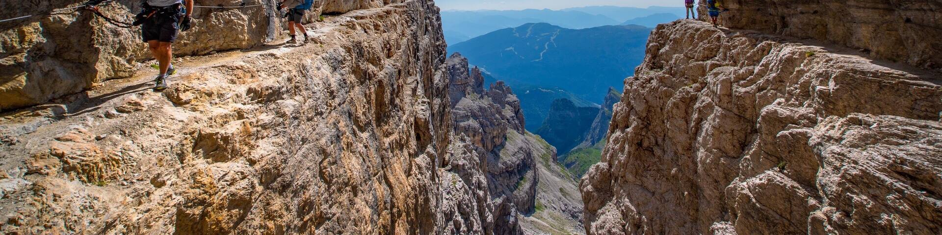 The spectacular Via Ferrata Bocchette in the Brenta group of the Dolomites in Italy. This is one of the most iconic sections of trail with breathtaking exposure and views. #Adventure #dolomites #italy #viaferrata #italianalps