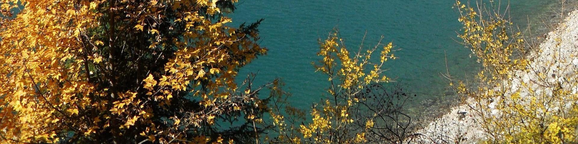 I went skiing somewhere up in the mountains behind and then descended through the gap to this gorgeous lake where I spent the night. Next morning I got up and left but couldn't help but stop to take this shot of the beautiful scenery.