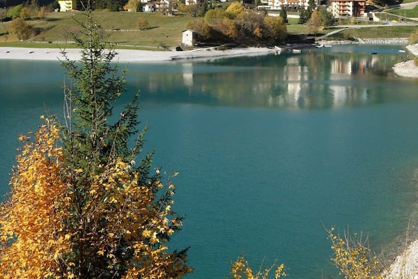 I went skiing somewhere up in the mountains behind and then descended through the gap to this gorgeous lake where I spent the night. Next morning I got up and left but couldn't help but stop to take this shot of the beautiful scenery.