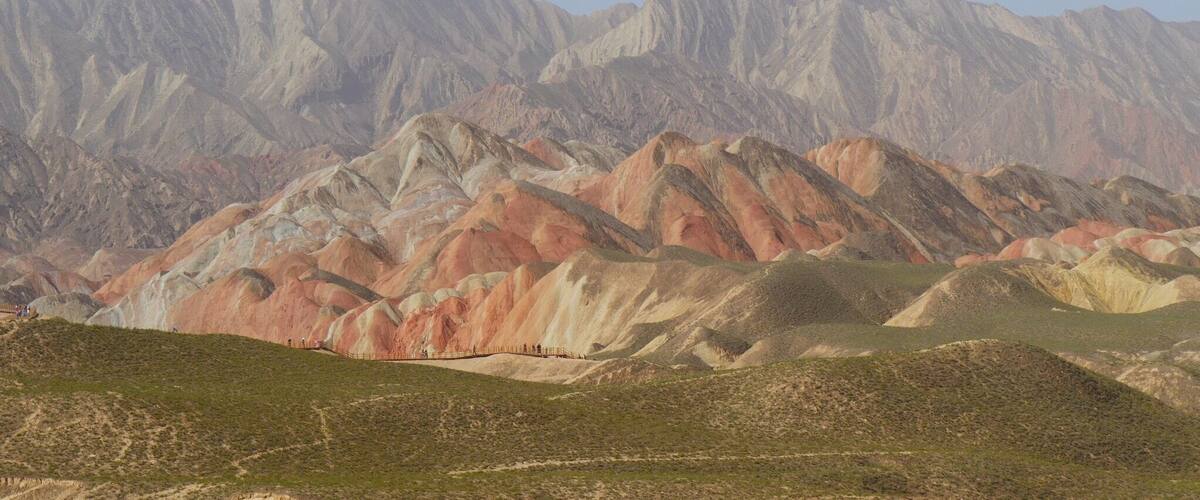 A mountain range with distinct red and white colored peaks.