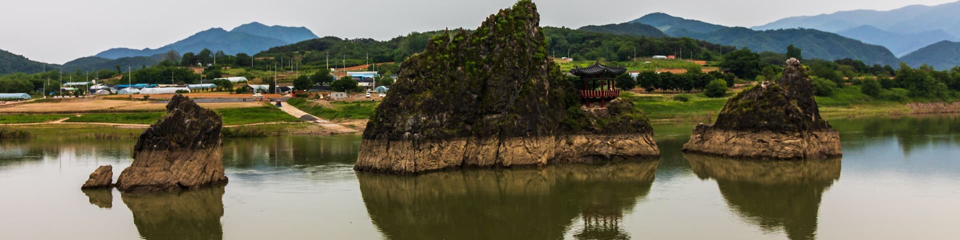 Panoramic view on Dodamsambong Peaks. Three stone peaks rising out of the Namhangang River. Danyang, North Chungcheong, South Korea, Asia.