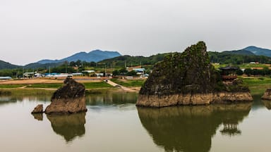 Panoramic view on Dodamsambong Peaks. Three stone peaks rising out of the Namhangang River. Danyang, North Chungcheong, South Korea, Asia.