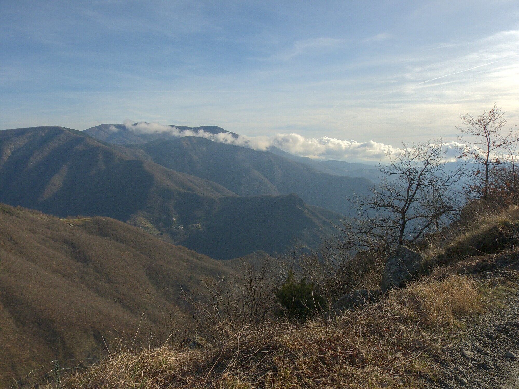 A mountainous landscape with rolling hills and a clear sky.