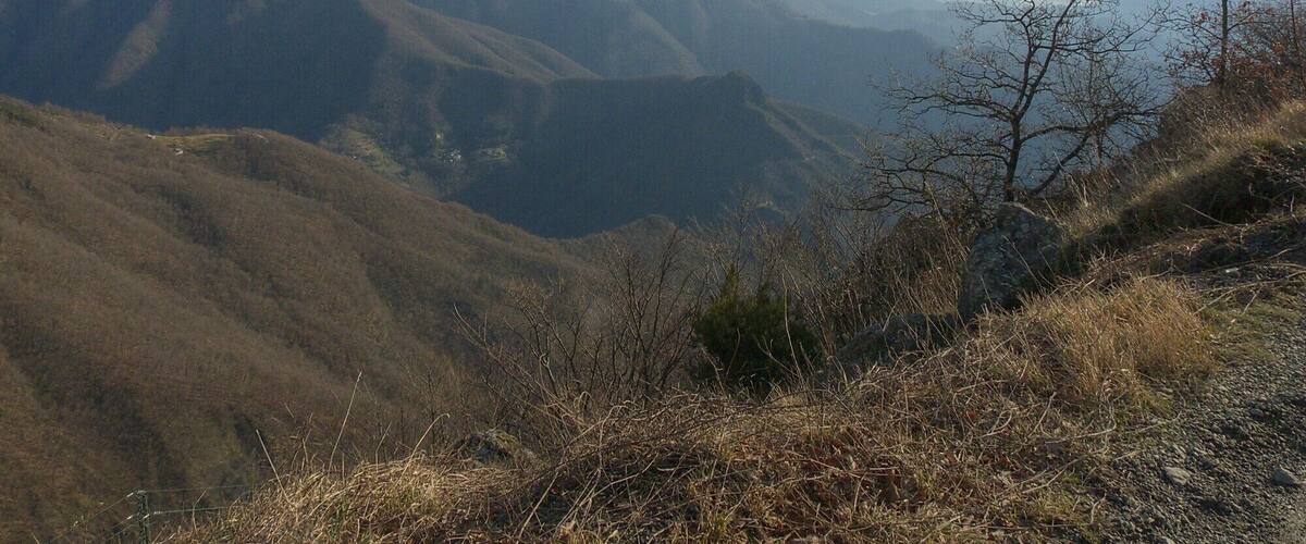 A mountainous landscape with rolling hills and a clear sky.