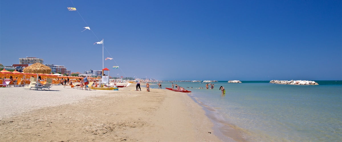 Torre Pedrera which includes swimming, general coastal views and a beach