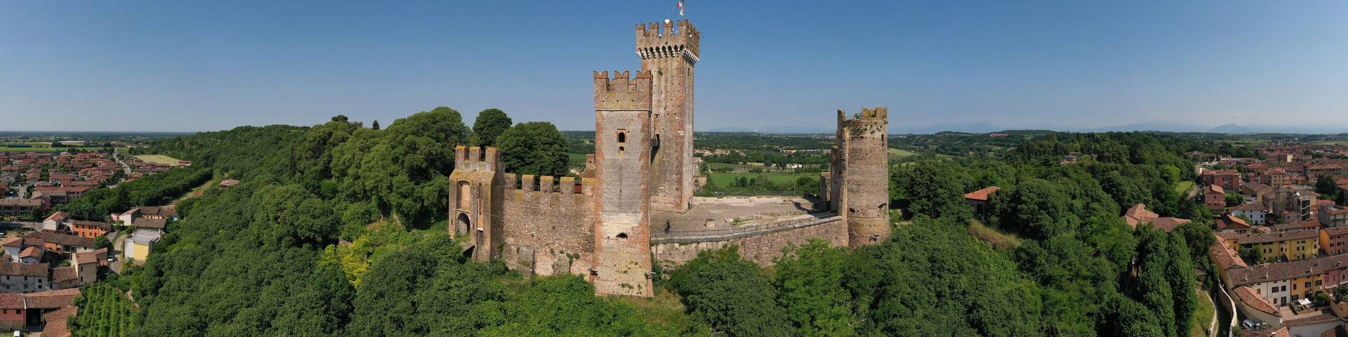 Aerial panorama of the Scaligero castle, Verona. Aerial view of the Italian historic castle Castello Scaligero on a hill. Castle Scaligero in Valeggio sul Mincio, Italy.