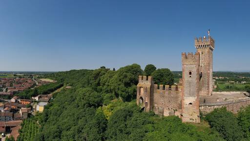 Aerial panorama of the Scaligero castle, Verona. Aerial view of the Italian historic castle Castello Scaligero on a hill. Castle Scaligero in Valeggio sul Mincio, Italy.