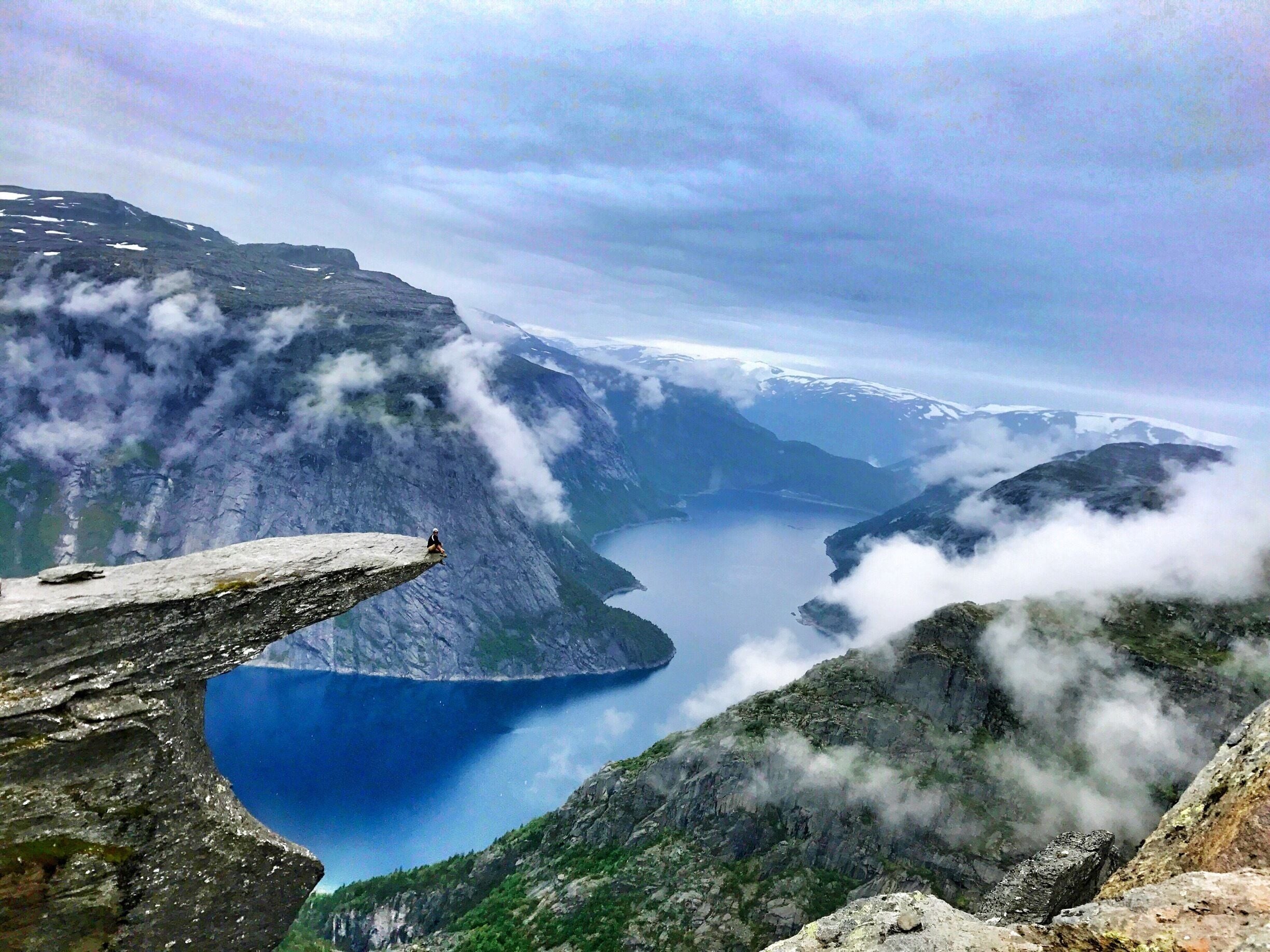 Roughly a 14 miles in and out hike in picturesque Norway. The trail was rated as difficult by many bloggers but I found it to be rather on the lower side of medium. The toughest part of the hike was the initial half mile or so ascent. Amazing views the whole way despite having rain through most of the hike. The clouds clear enough for me to get a photo at the end of the ledge (troll's tongue). 