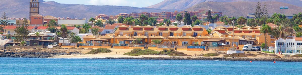 Corralejo featuring general coastal views, mountains and a coastal town