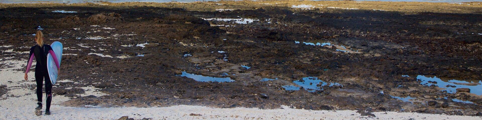 Corralejo which includes mountains, general coastal views and surfing