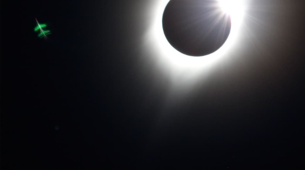 August 21 eclipse on totality line. Plane showed up when I imported to photoshop...no idea why plane is green but I read the eclipse changes colors.