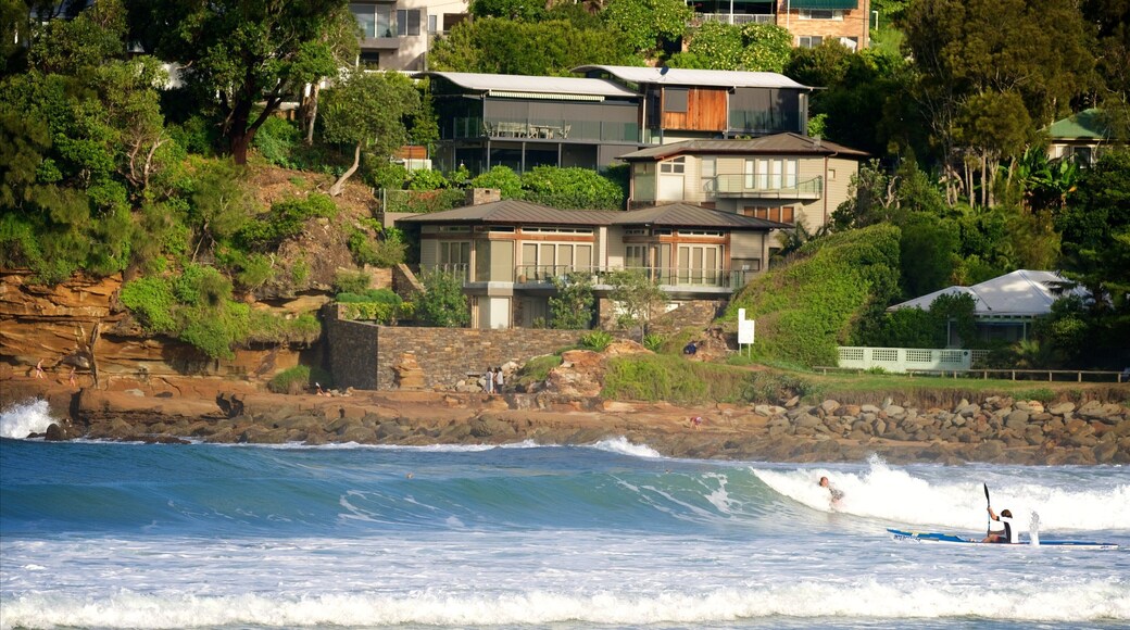 Avoca Beach showing surf, rugged coastline and a bay or harbour
