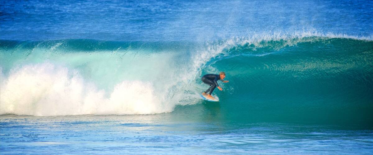 Avoca Beach which includes waves, surfing and a bay or harbor